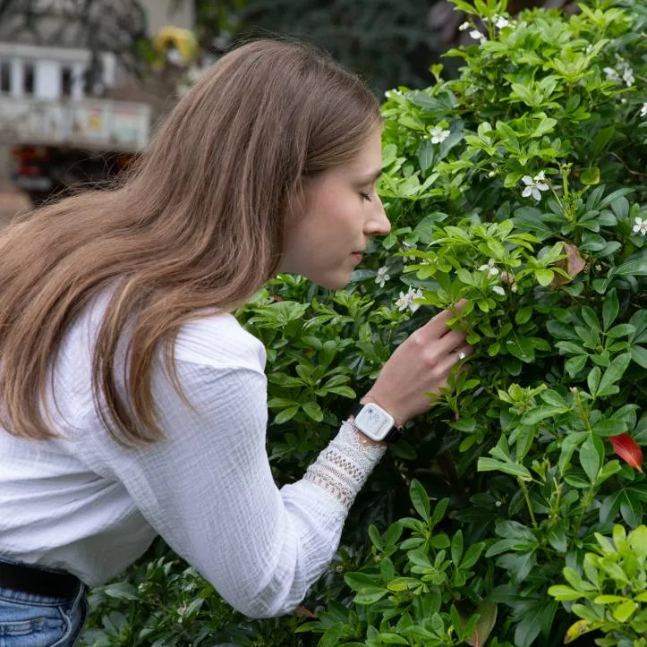 A woman wearing Syde wearable and appreciating nature